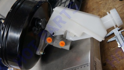 Brake pump with booster and fluid reservoir